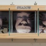 My Shadow Self Portrait Mixed media, photos on transparency sheet, found objects 5″ x 33″ x 3″ $1,100 Tim Barton